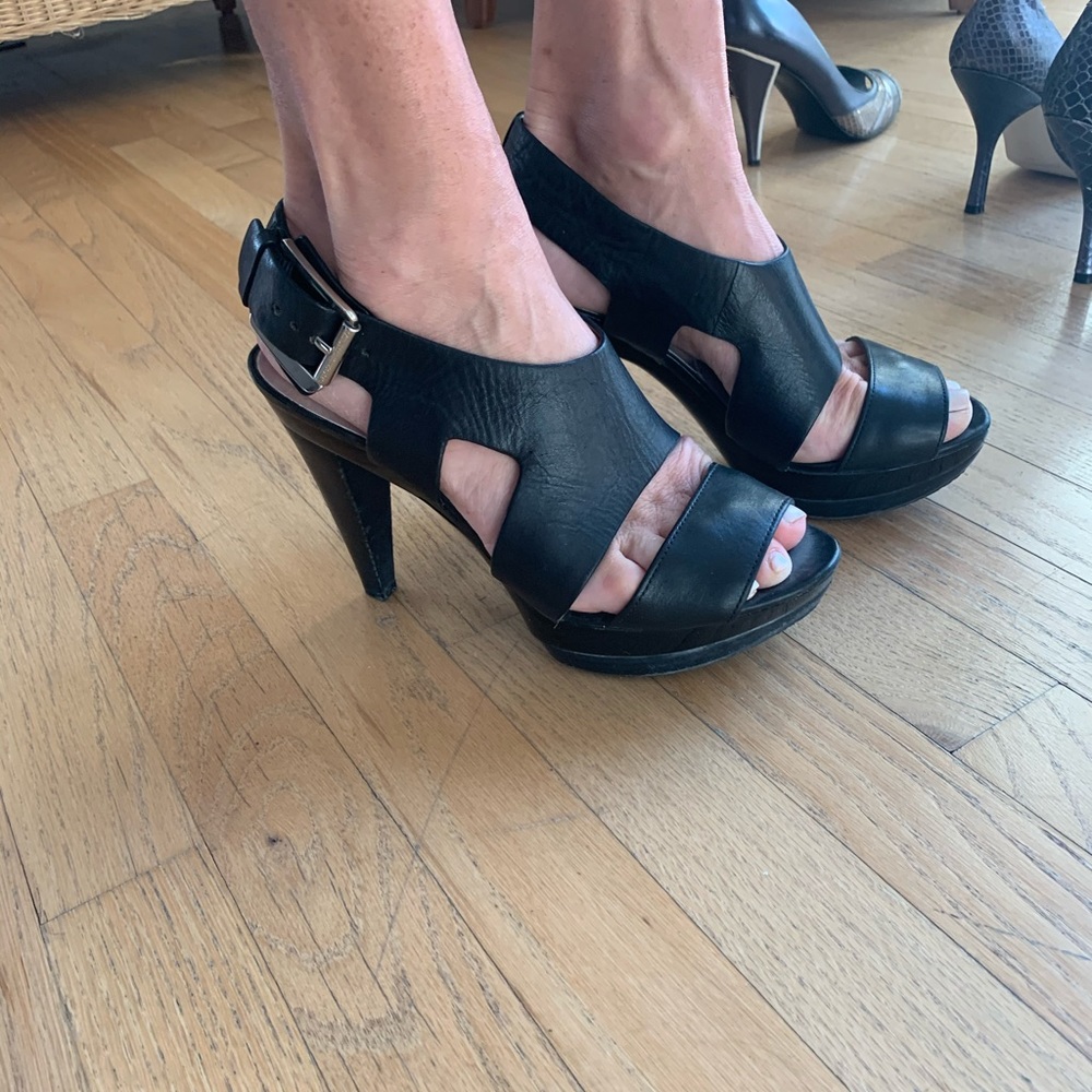 Michael Kors black leather heels w/silver buckle.
